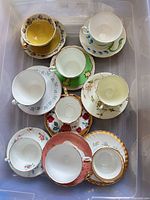 Top view of nine cup and saucer sets in bin
