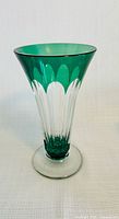 Full view of teal green crystal trumpet vase