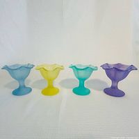 Four pastel frosted glass dessert bowls front view