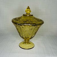 Full view of covered amber Depression glass candy dish on pedestal