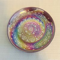 Front of iridescent Jupiter stand top showing pattern and color