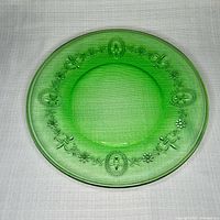 Front of green Cameo pattern plate showing medallions and border detail
