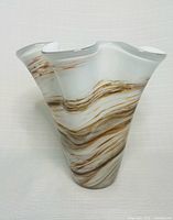 Front view of the handkerchief swirl glass vase showing ruffled rim and brown amber swirls