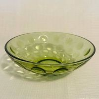 Side view of avocado green Hazel-Atlas Eldorado bowl highlighting coin-dot exterior texture