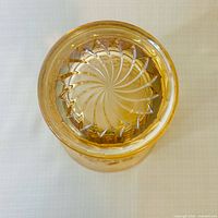 Base view illustrating swirl motif and iridescent finish