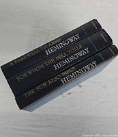 Spines of three Hemingway hardcover books