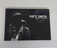 Front cover showing title, artist name, and photographer credit