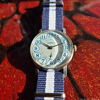 Front view of Pobeda watch showing dial and strap