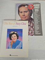 Front covers of both songbooks showing titles and artists