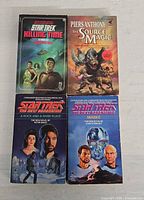 Front covers of four paperback novels