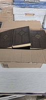 Three brown The University Library hardcovers in shipping box