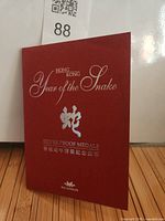 Front cover of red presentation booklet, titled Hong Kong Year of the Snake Silver Proof Medals