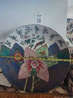 Front view of plate with measuring tape showing diameter