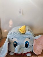 Front view showing Dumbo face, hat, ears, collar