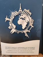 Front of presentation card showing globe and landmark graphics