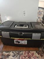 Closed toolbox front view showing brand label and latches