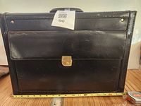 front view showing pocket, clasp and width measurement