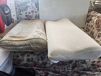 Two pillows side-by-side on sofa showing shape and covers