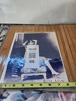 Full view of photograph with measuring tape showing 8 inch width