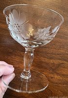 Side view of one dessert dish showing etched Cornflower pattern and stem
