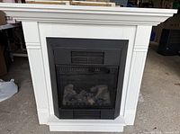 Front view showing entire fireplace, mantel detail and firebox insert