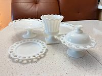 Group view of all five milk glass pieces