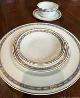 Stacked and single place-setting view showing pattern details