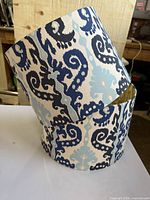 Two ikat-pattern drum lamp shades stacked
