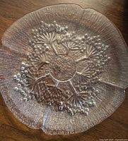 Single plate showing overall cow parsley pattern and scalloped edge