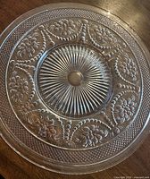 Top view of one plate showing sunburst and floral pattern