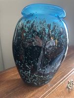 Front view showing blue rim and speckled body