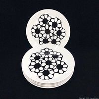 Stack of six Johnson Bros Cordova plates with one plate upright displaying pattern