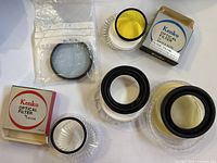 Assorted lens filters, adapter rings and packaging