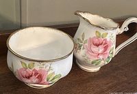 Sugar bowl and creamer side by side showing pattern and sizes