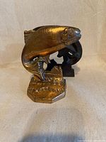 Front view of brass fish bookends