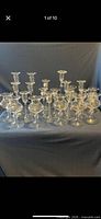 Full group of 22 glass candle holders displayed