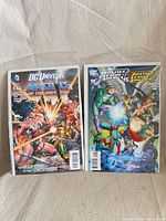 Front view of both comic issues in bags