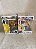 Front view of both boxed figures: Gamora #382 and Edward Elric #1176