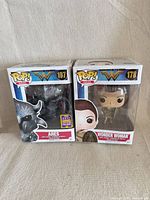 Front view of both boxed Funko Pop! figures side by side