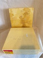 Two Kodak boxes, front view showing labeling and handwriting