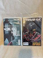 Front covers of both comics in bags