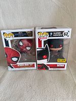 Front view of both boxed Funko Pop figures