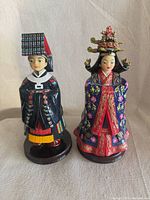 Front view of both Korean wedding figurines