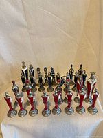 Full set of 29 pewter chess pieces front view
