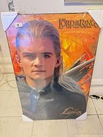 Front view of Legolas cardboard standee with plastic wrap and foam corners