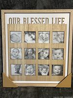 Front view of natural wood multi-photo frame with phrase and 12 openings, corner protectors attached
