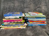 Two stacks of children’s books showing titles and bindings