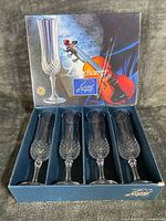 Boxed set showing exterior artwork and four flutes in packaging