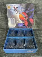 Front of retail box showing brand, pattern name and violin imagery