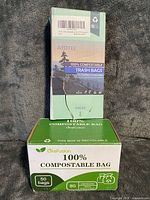 Front view of two boxes showing brands, compostable claim and certifications